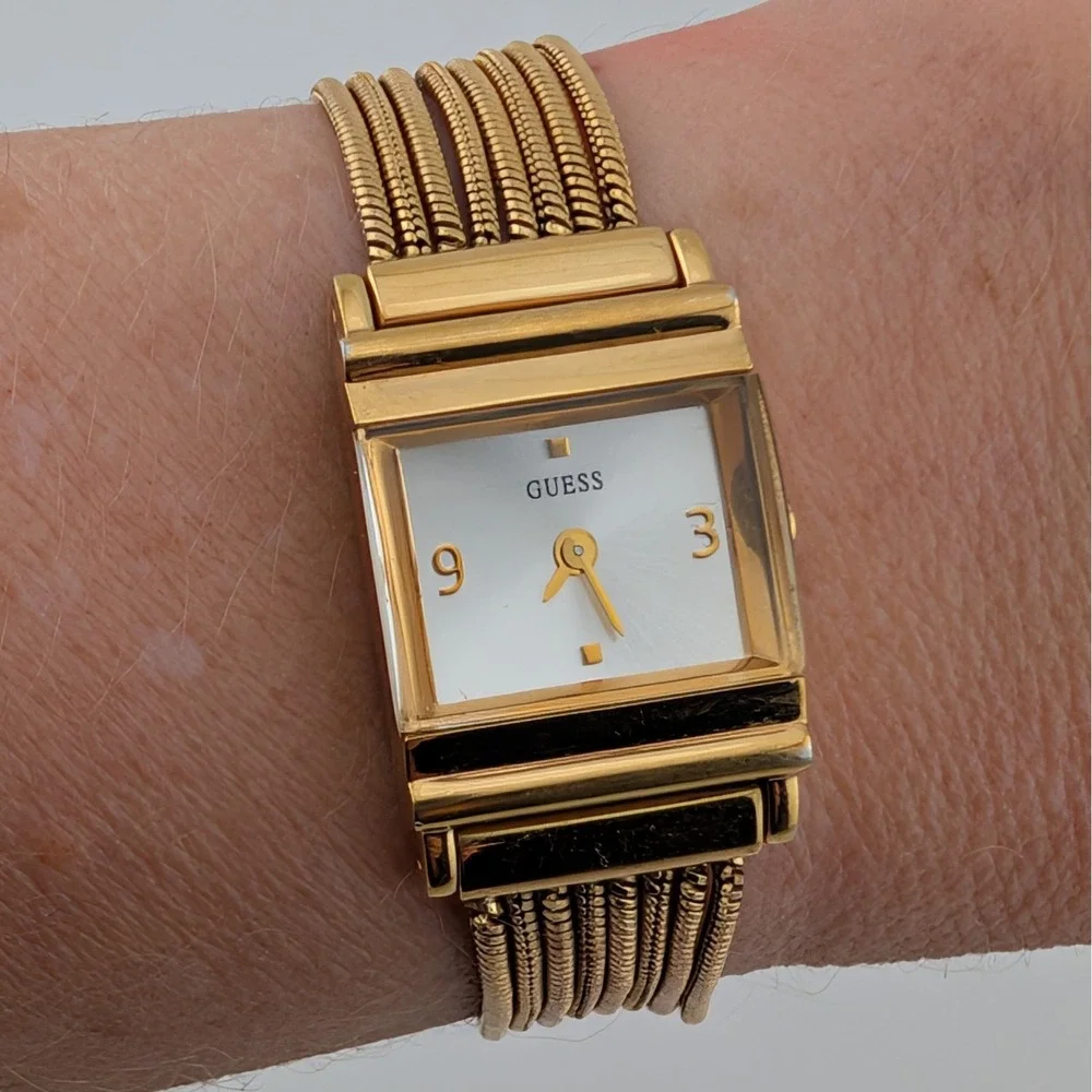Guess Women's Gold Tone Multi Strand Bracelet Watch Silver Sunburst Dial